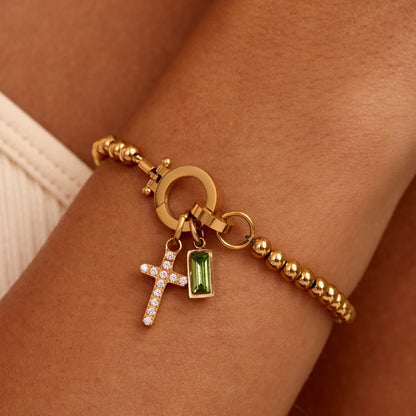 Perlenarmband mit Kreuz-Charm und Geburtsstein